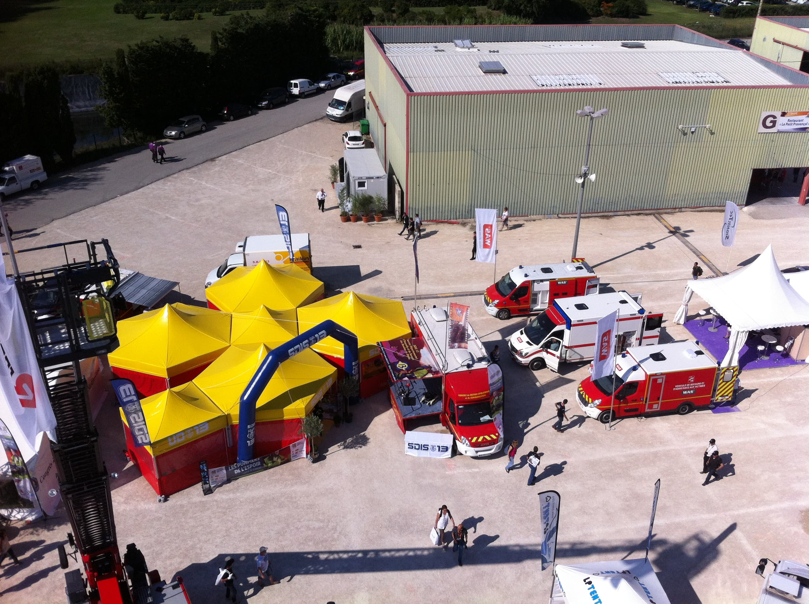 Emergency response tent complex with fire service vehicles