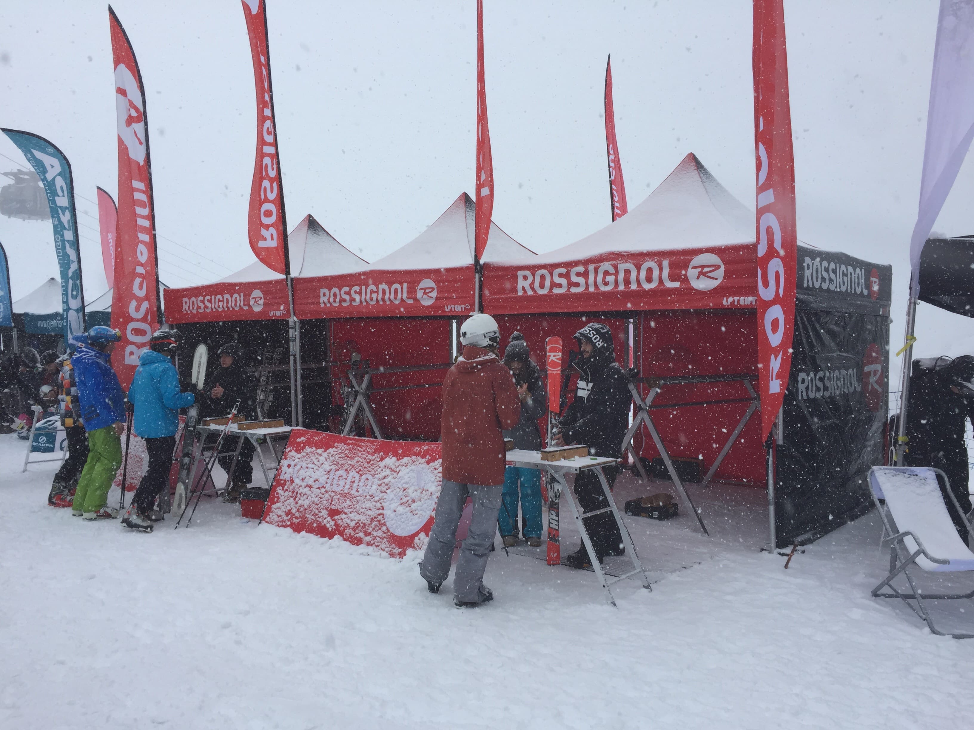 LP Tent branded pop-up gazebos operating in heavy snowfall — demonstrating weather resilience