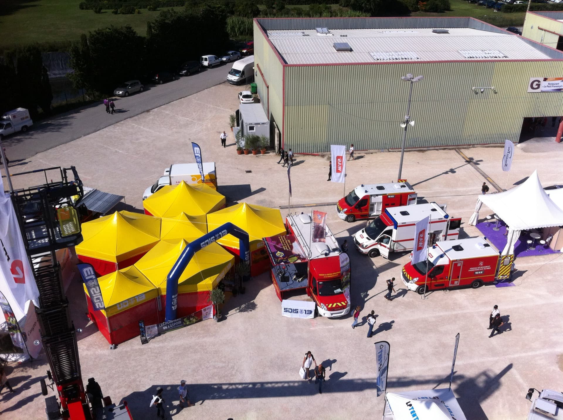 Emergency response tent complex with fire service vehicles