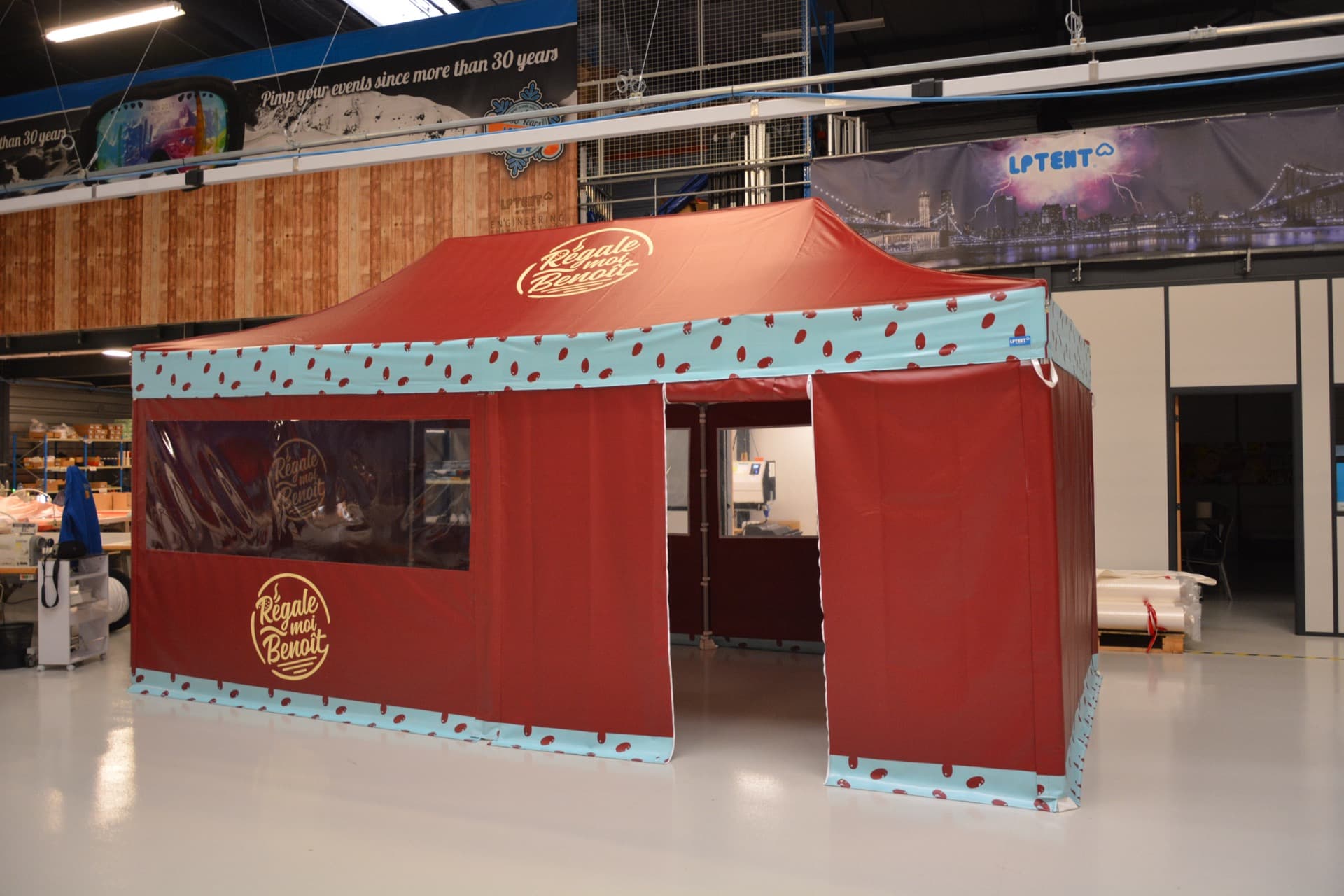 Custom-branded LP Tent catering food stall with window panels