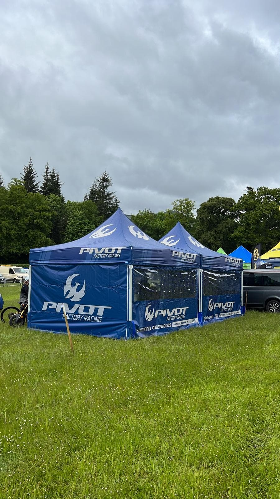 Branded professional event shelter in use outdoors