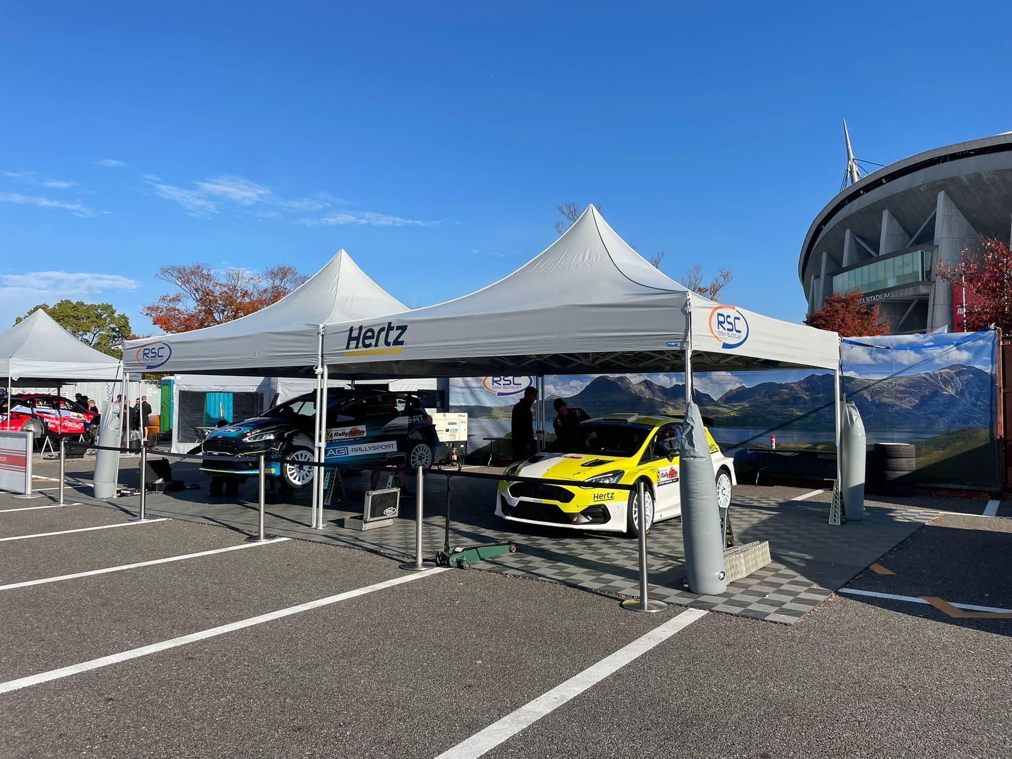 A linked LP Tent paddock complex at a motorsport circuit