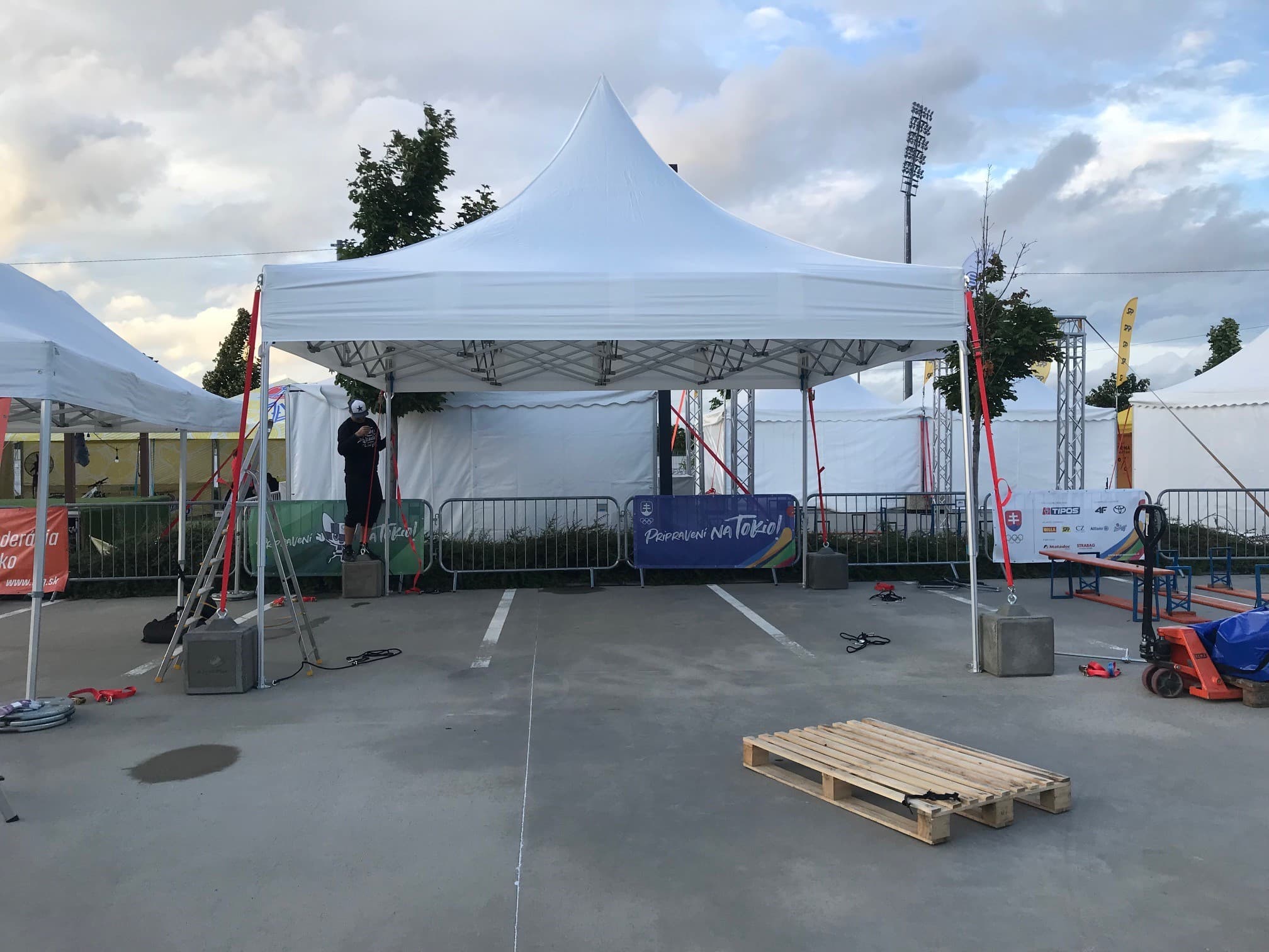 White LP Tent professional shelter with aluminium frame and anchoring in use