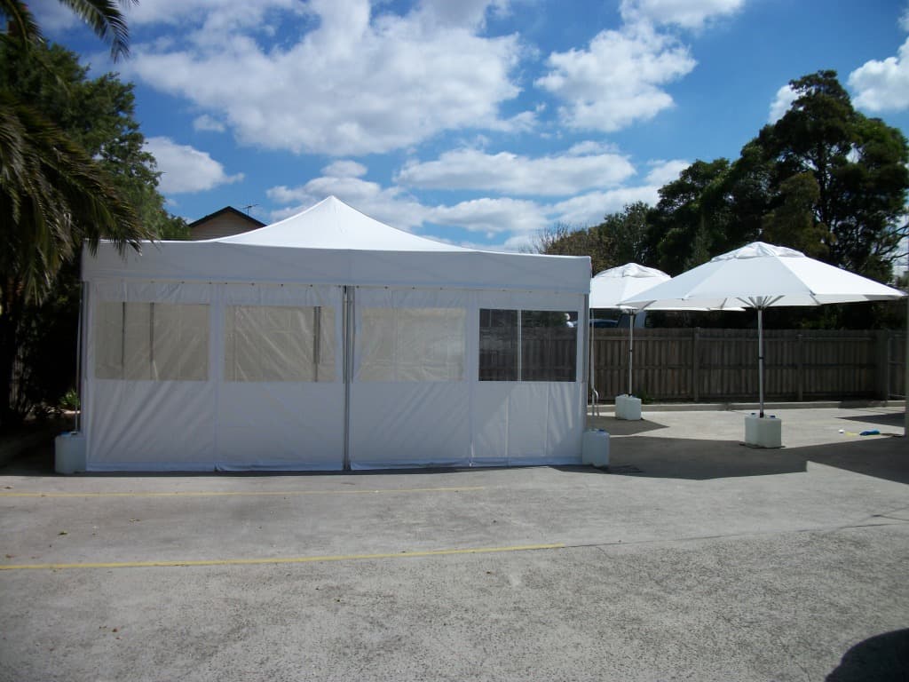 White professional tent structure set up outdoors