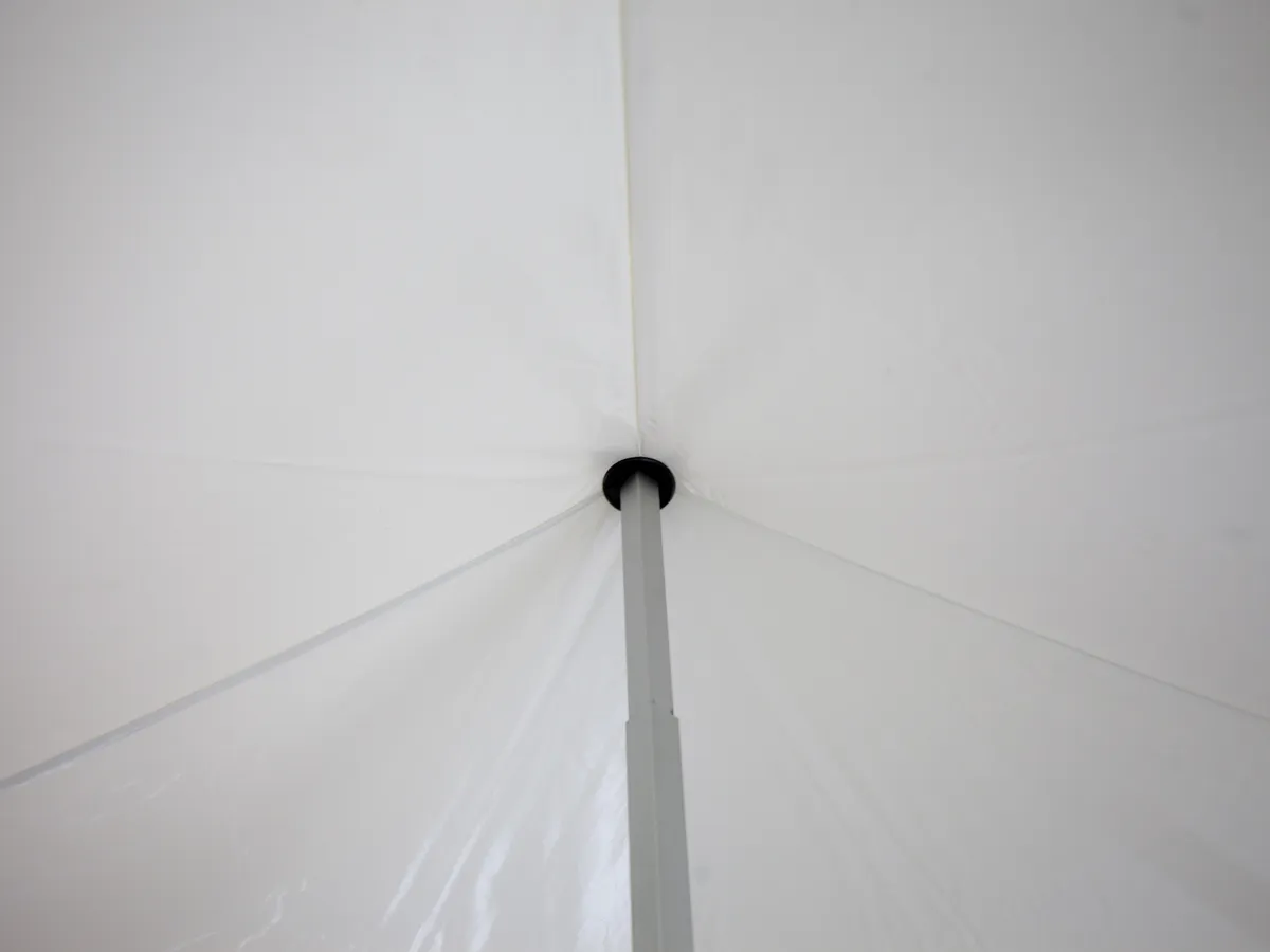 Reinforced canopy peak at the centre pole of an LP Tent pop-up gazebo, seen from inside