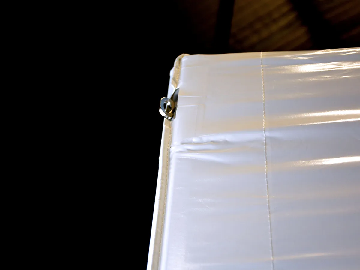 Integrated tie-down ring at the corner of an LP Tent XP canopy